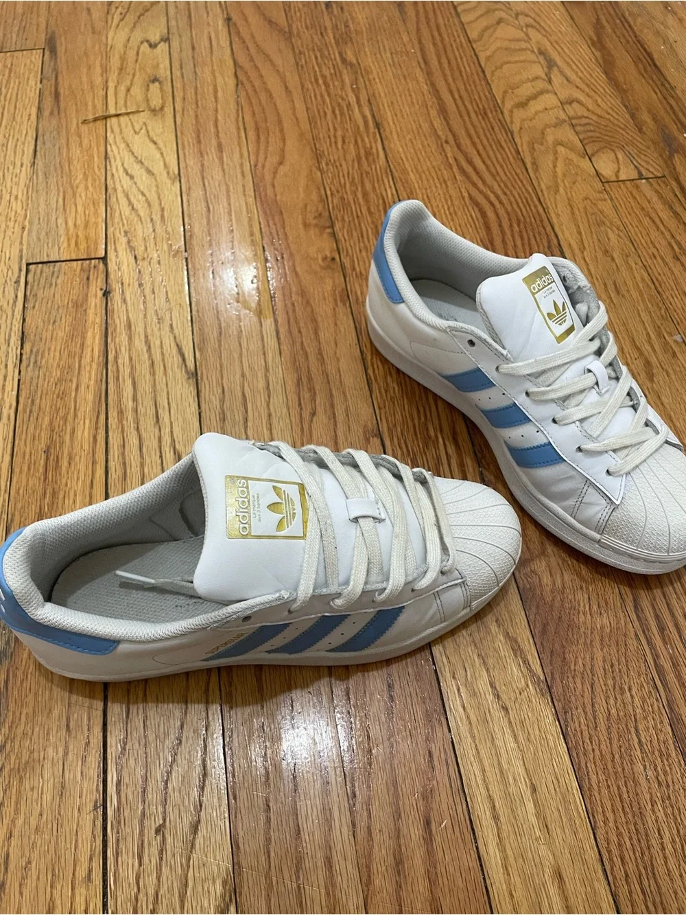 adidas Superstar Men’s Sneakers in White with Light Blue Stripes